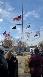 Flags flying and wreath presentation
